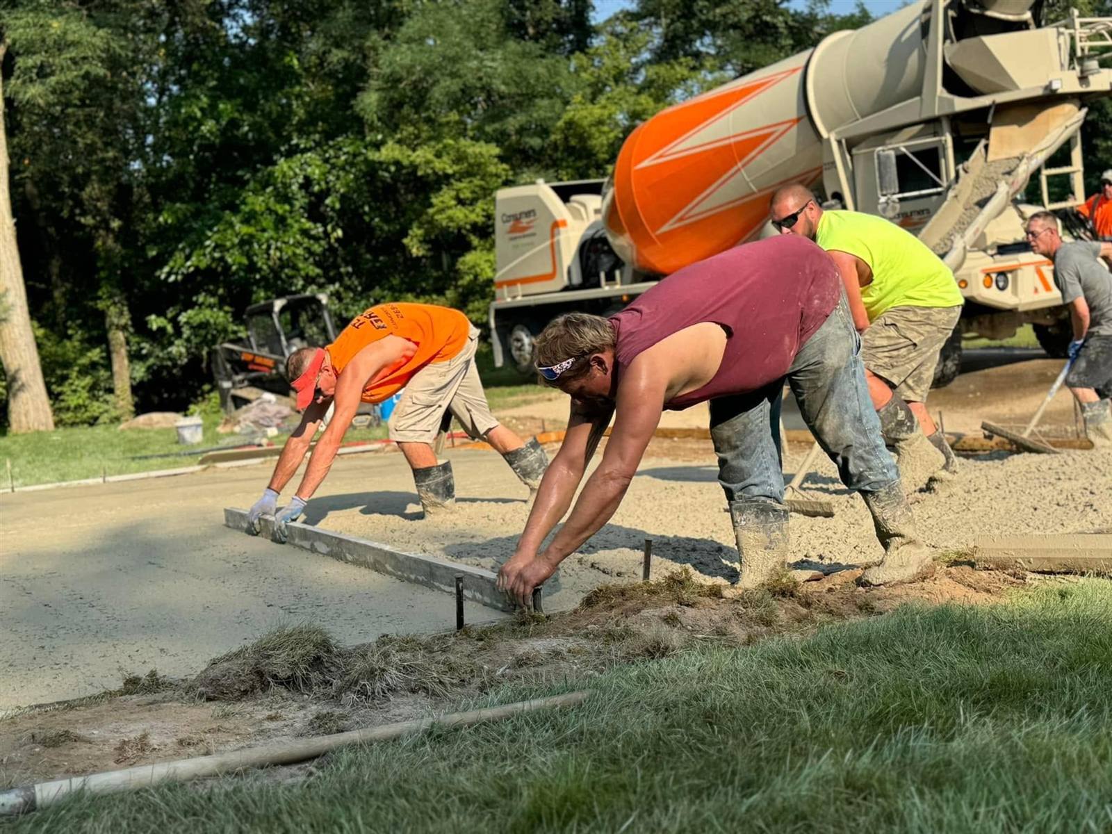 Top Grade crew finishing a fresh concrete pour